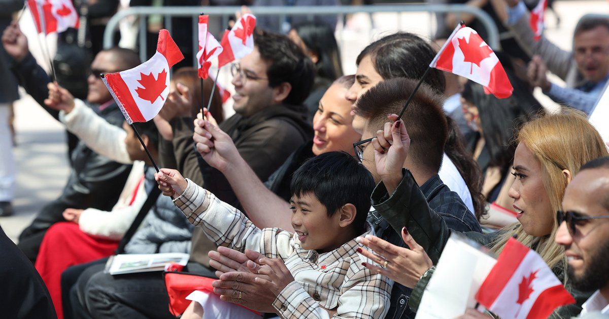 Canada Immigration People Cheering and holding Canada Flag